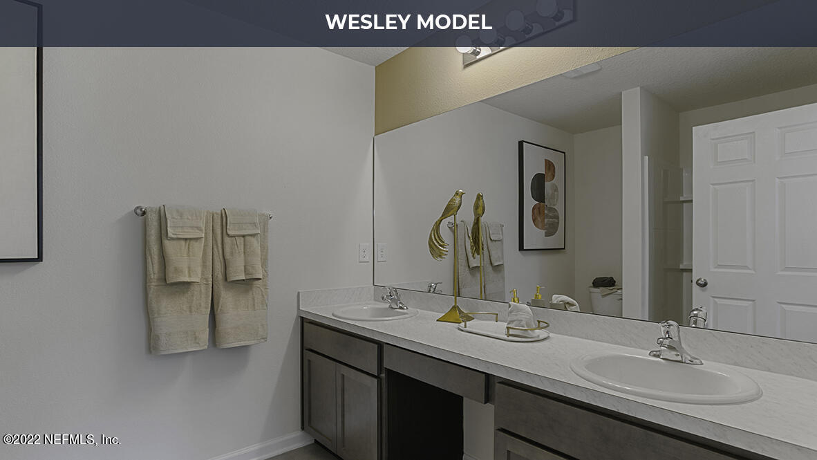 73 Java Lane St. Augustine, FL 32092 - Photo 11 of 30 a bathroom with a sink and a mirror