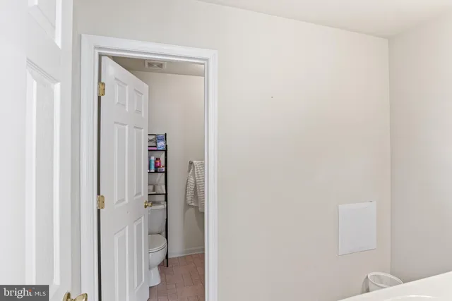 a spacious bedroom with a bed and a window