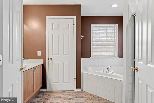 a kitchen with stainless steel appliances a sink and a refrigerator