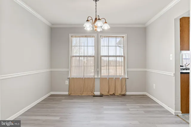 a kitchen with sink cabinets and living room