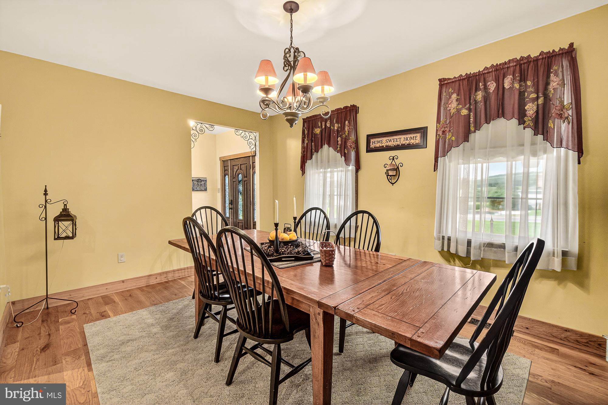 4948 Teen Barnes Road Frederick, MD 21703 - Photo 12 of 56 a dining room with furniture a chandelier and window