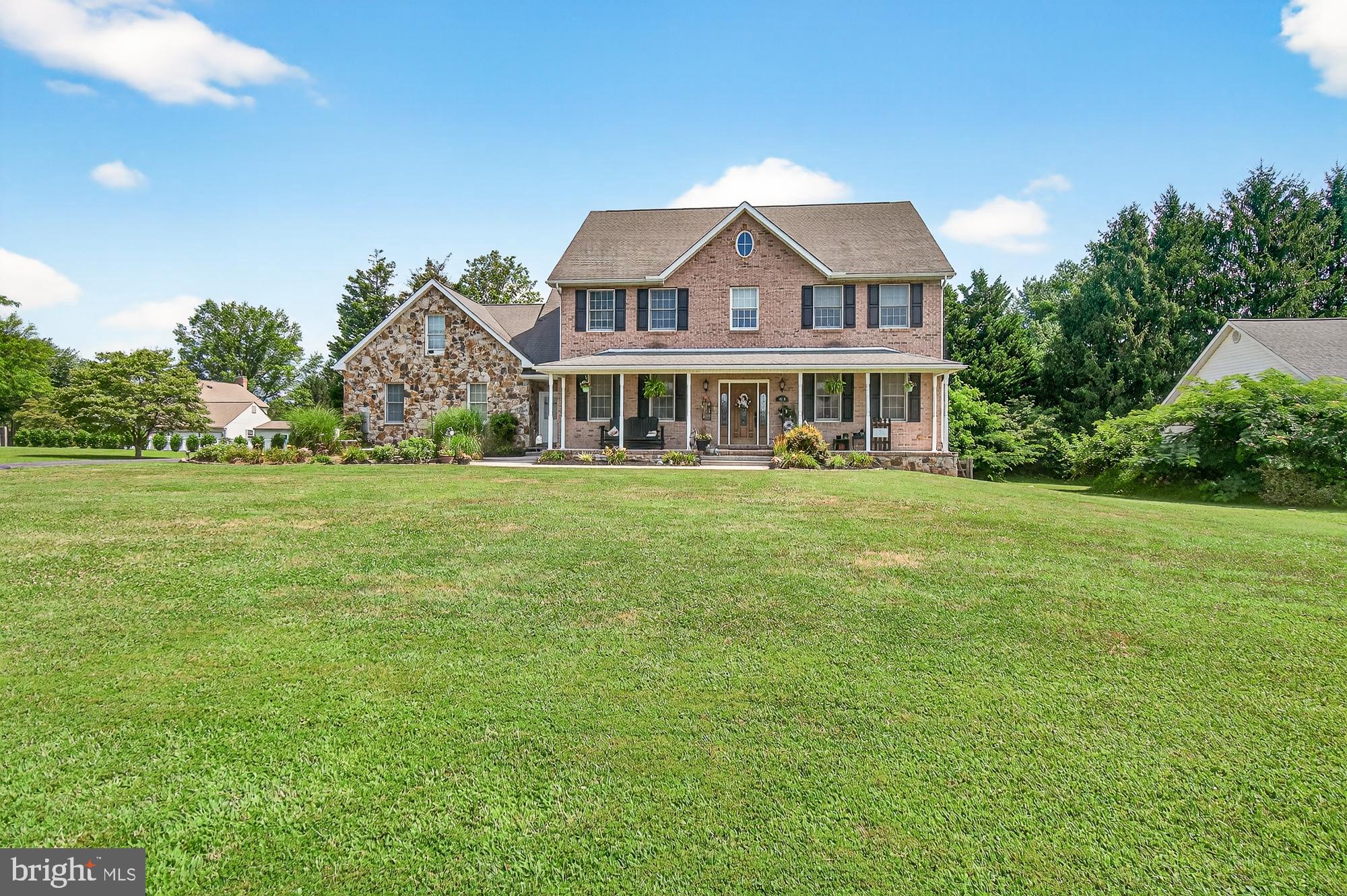 4948 Teen Barnes Road Frederick, MD 21703 - Photo 2 of 56 a front view of a house with a garden