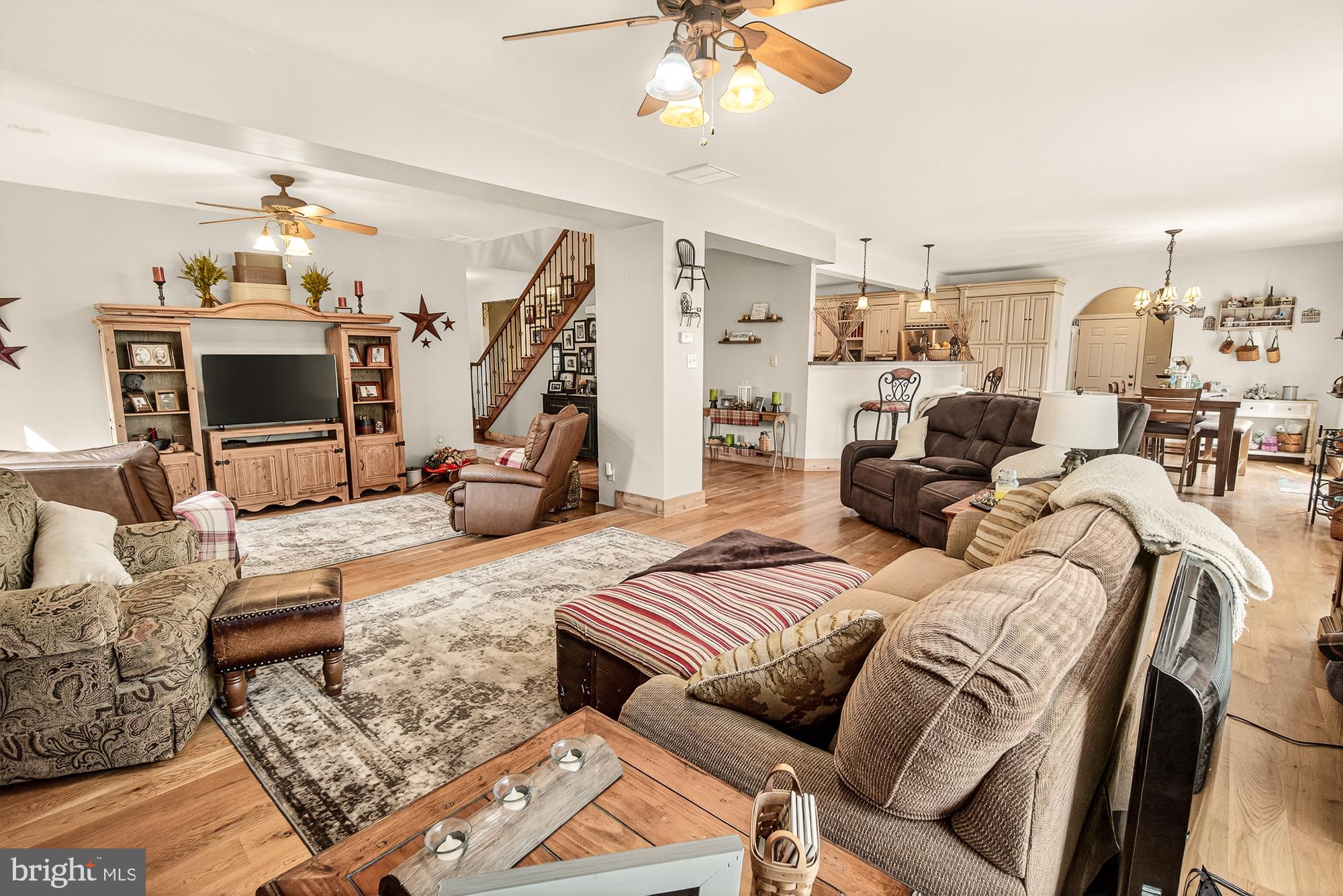 4948 Teen Barnes Road Frederick, MD 21703 - Photo 24 of 56 a living room with furniture and a chandelier