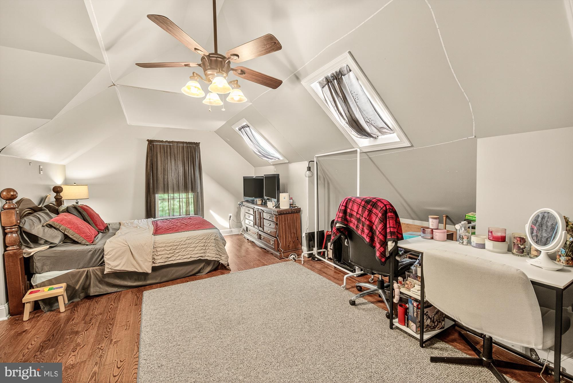 4948 Teen Barnes Road Frederick, MD 21703 - Photo 30 of 56 a room with gym equipment and a chandelier