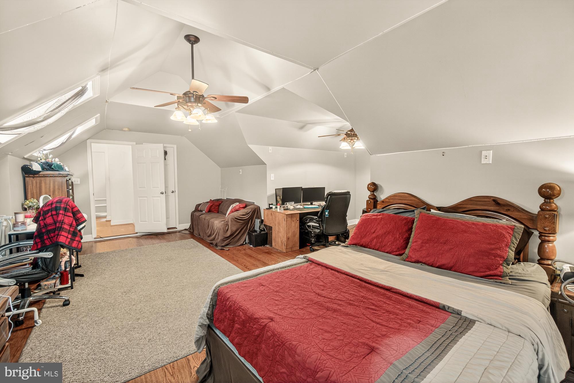 4948 Teen Barnes Road Frederick, MD 21703 - Photo 31 of 56 a bedroom with two bed and a chandelier