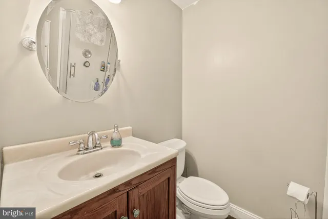 a bathroom with a glass shower door and a shower