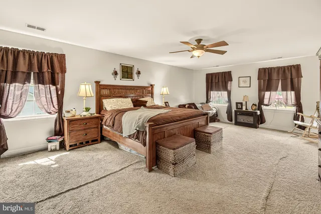 a bedroom with furniture and window
