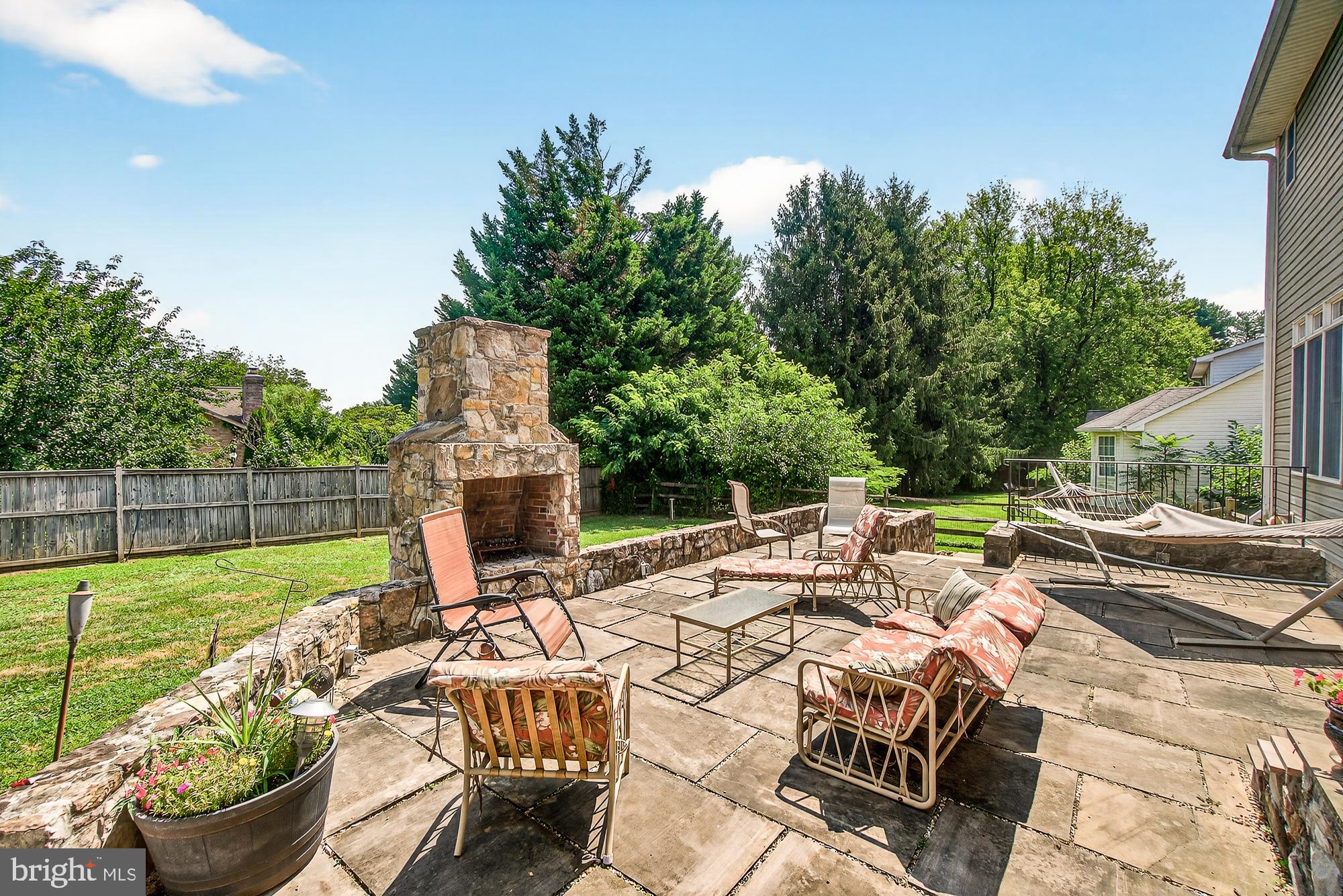 4948 Teen Barnes Road Frederick, MD 21703 - Photo 48 of 56 a view of a patio with couches chairs and a potted plant