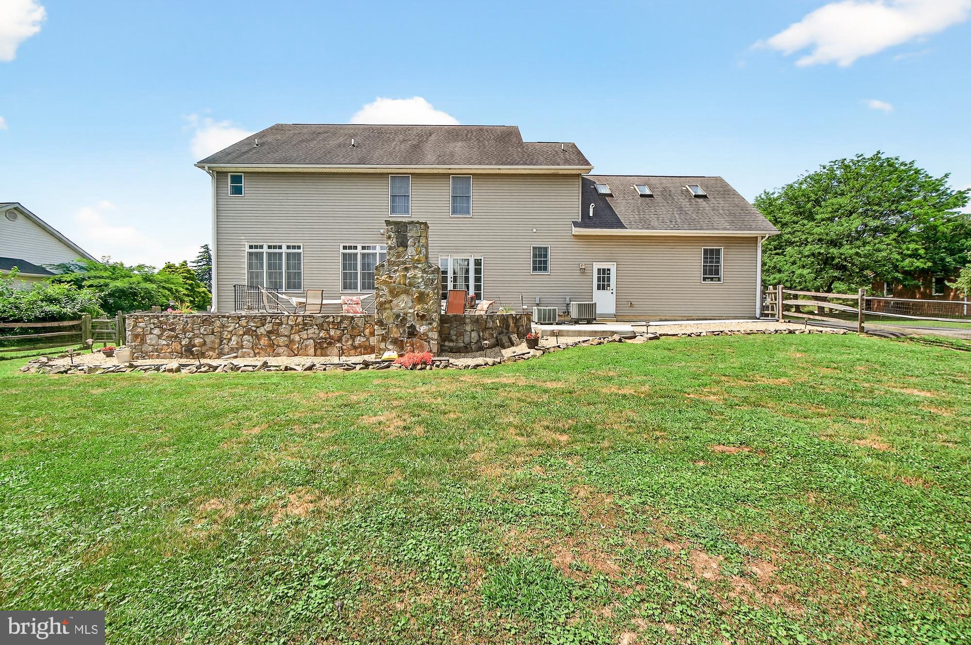 4948 Teen Barnes Road Frederick, MD 21703 - Photo 49 of 56 a front view of house with yard and outdoor seating