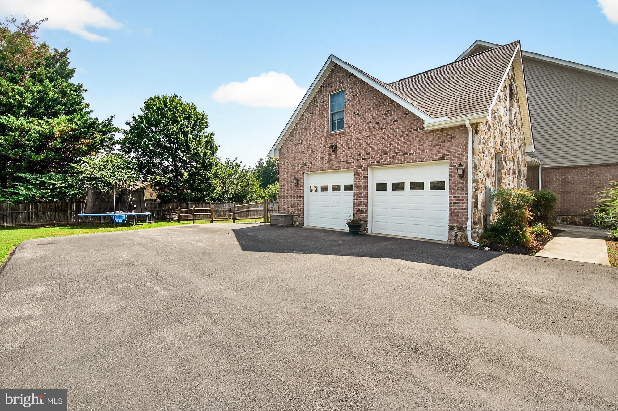4948 Teen Barnes Road Frederick, MD 21703 - Photo 55 of 56 a view of a house with a yard and palm trees