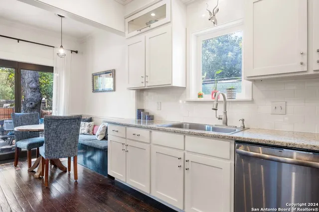 a kitchen with sink cabinets and window