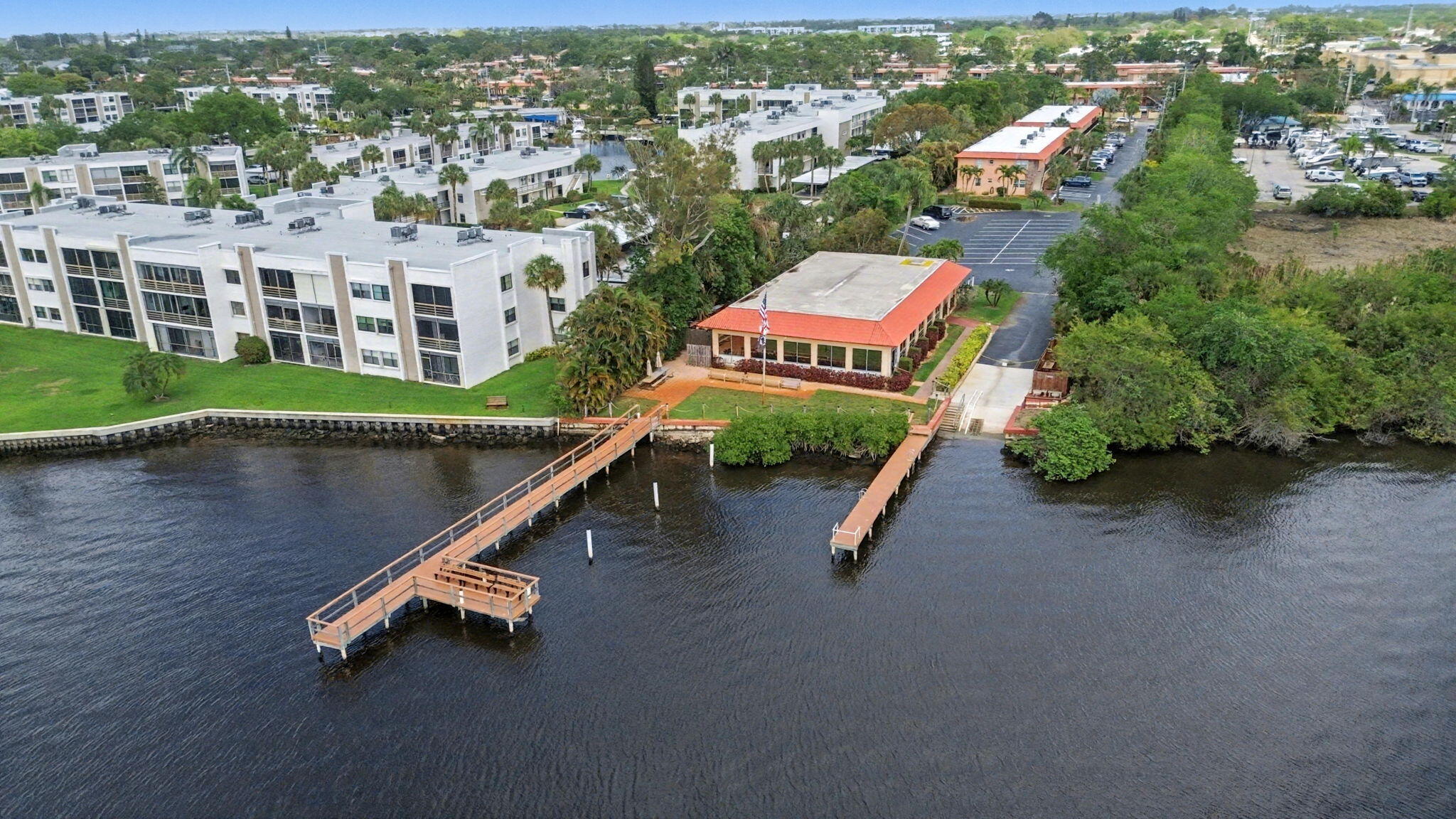 1967 Southwest Palm City Road, Unit 34C Stuart, FL 34994 - Photo 21 of 25 an aerial view of residential house with outdoor space and lake view