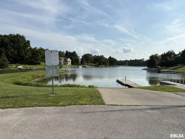 a view of a lake with houses in background
