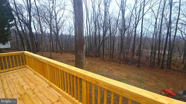 a view of balcony with yard