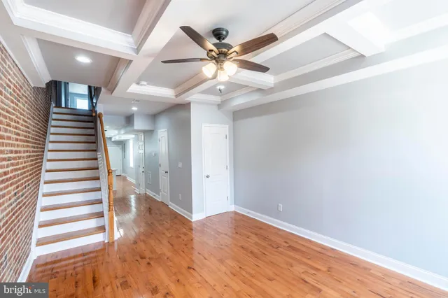 a view of an entryway with wooden floor
