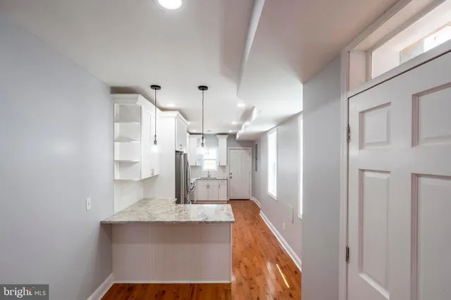 a view of a kitchen with a sink