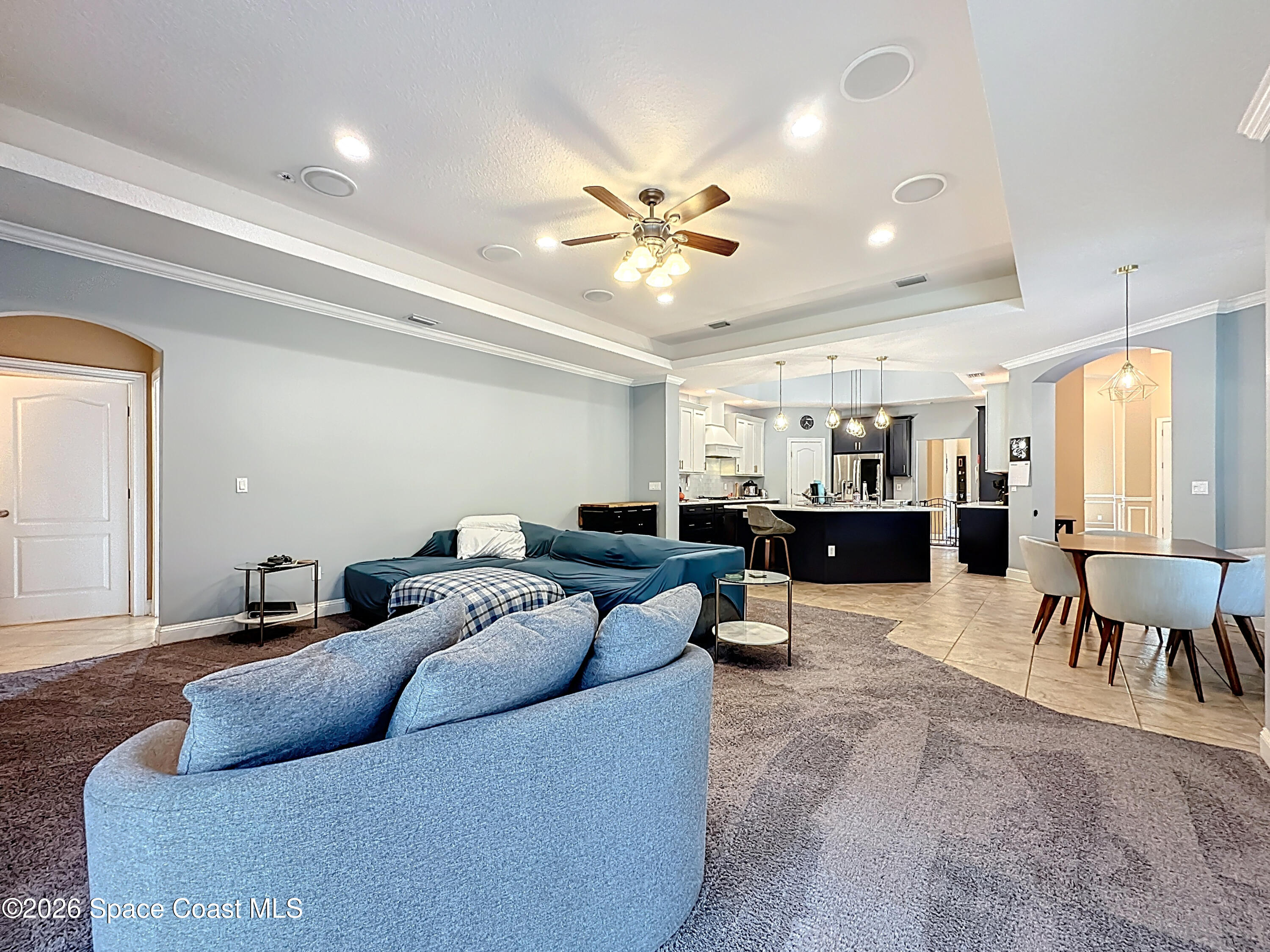 2851 Armsdale Road Jacksonville, FL 32218 - Photo 23 of 89 a living room with furniture and a chandelier