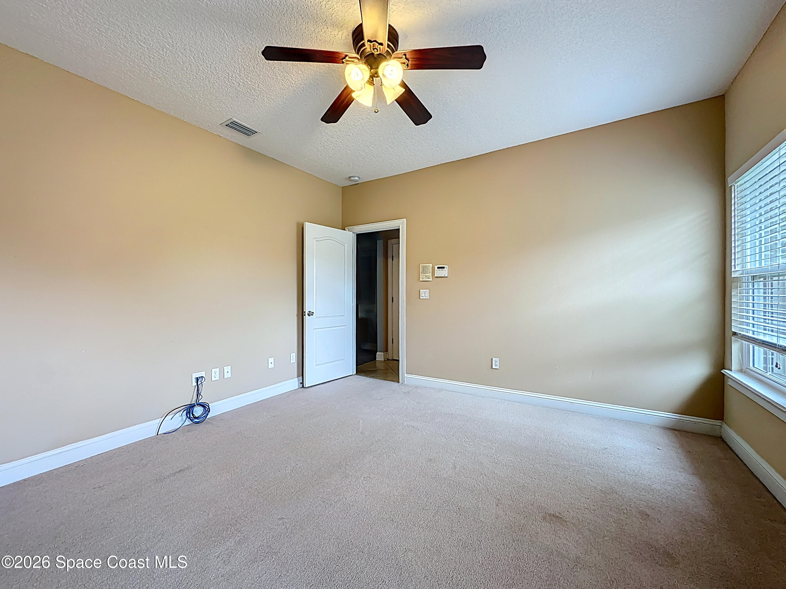 2851 Armsdale Road Jacksonville, FL 32218 - Photo 35 of 89 a view of a big room with windows and chandelier fan