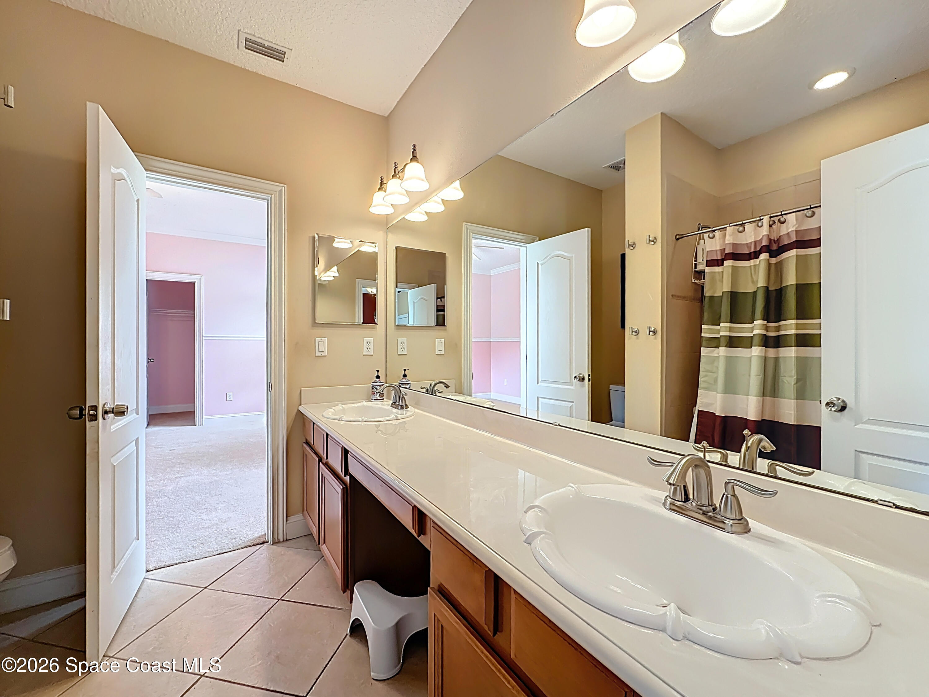 2851 Armsdale Road Jacksonville, FL 32218 - Photo 55 of 89 a bathroom with a sink double vanity and a mirror