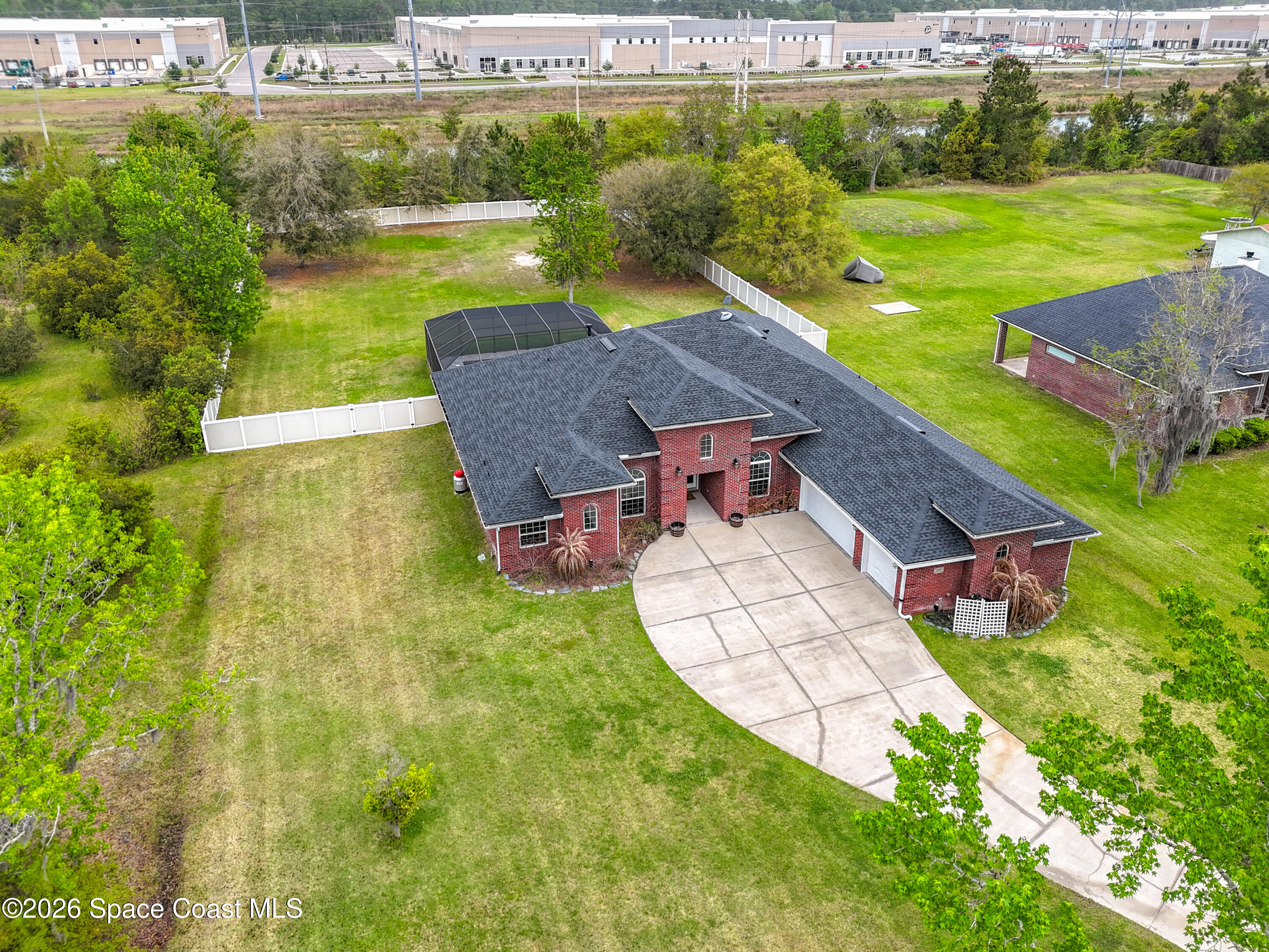 2851 Armsdale Road Jacksonville, FL 32218 - Photo 72 of 89 an aerial view of a house with pool a yard and lake view