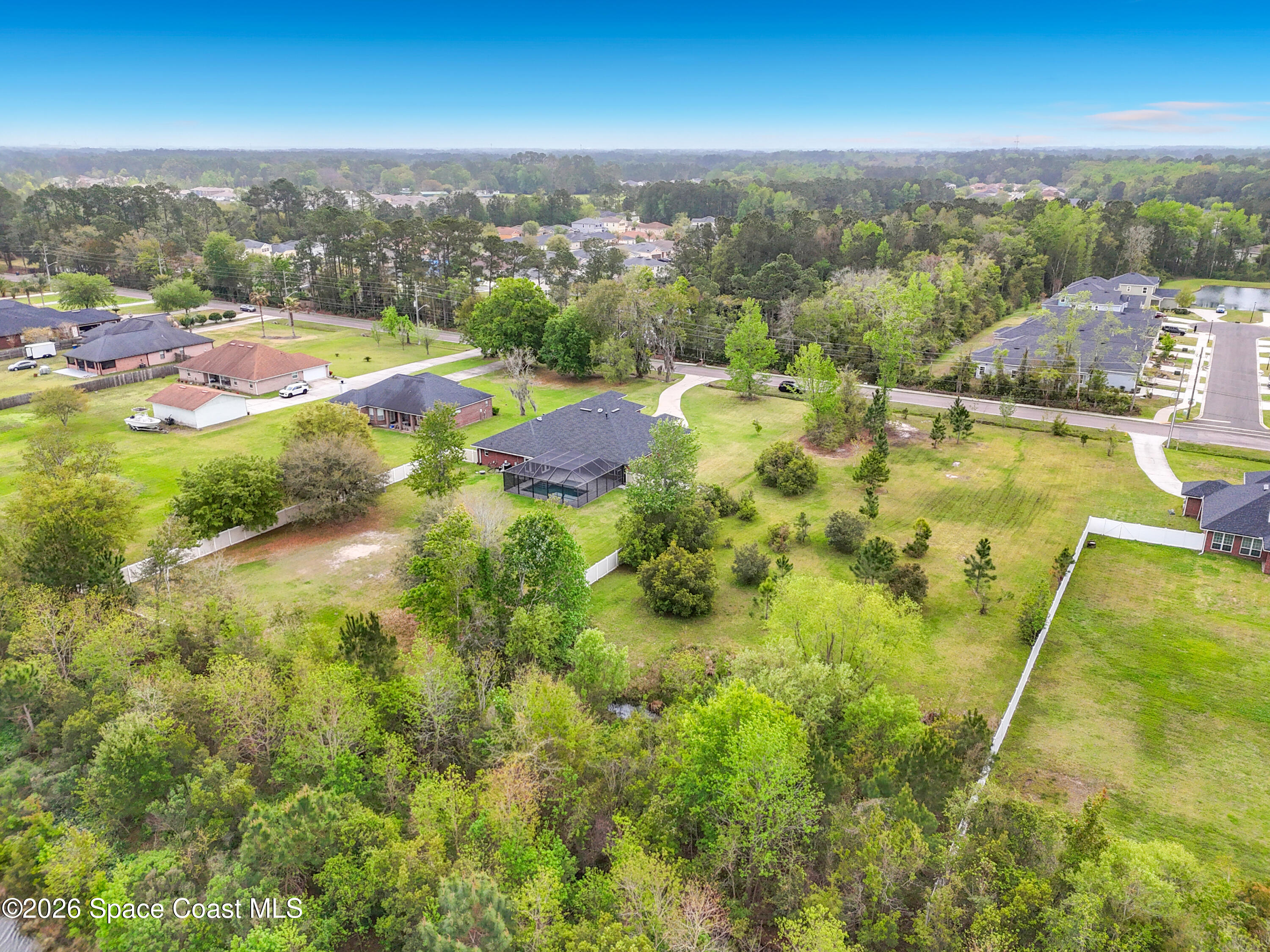 2851 Armsdale Road Jacksonville, FL 32218 - Photo 82 of 89 an aerial view of residential houses with outdoor space