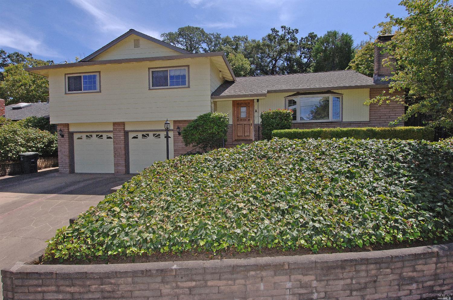 front view of a house with a bench