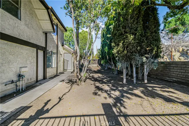 a view of a backyard with a patio