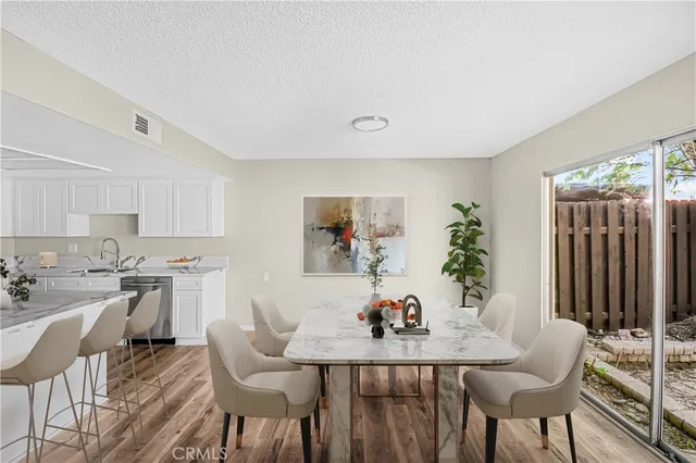 a view of a dining room with furniture and window
