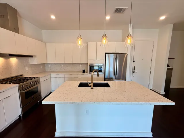 a view of hallway with wooden floor