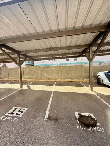 a view of a backyard with a small cabin and a chair