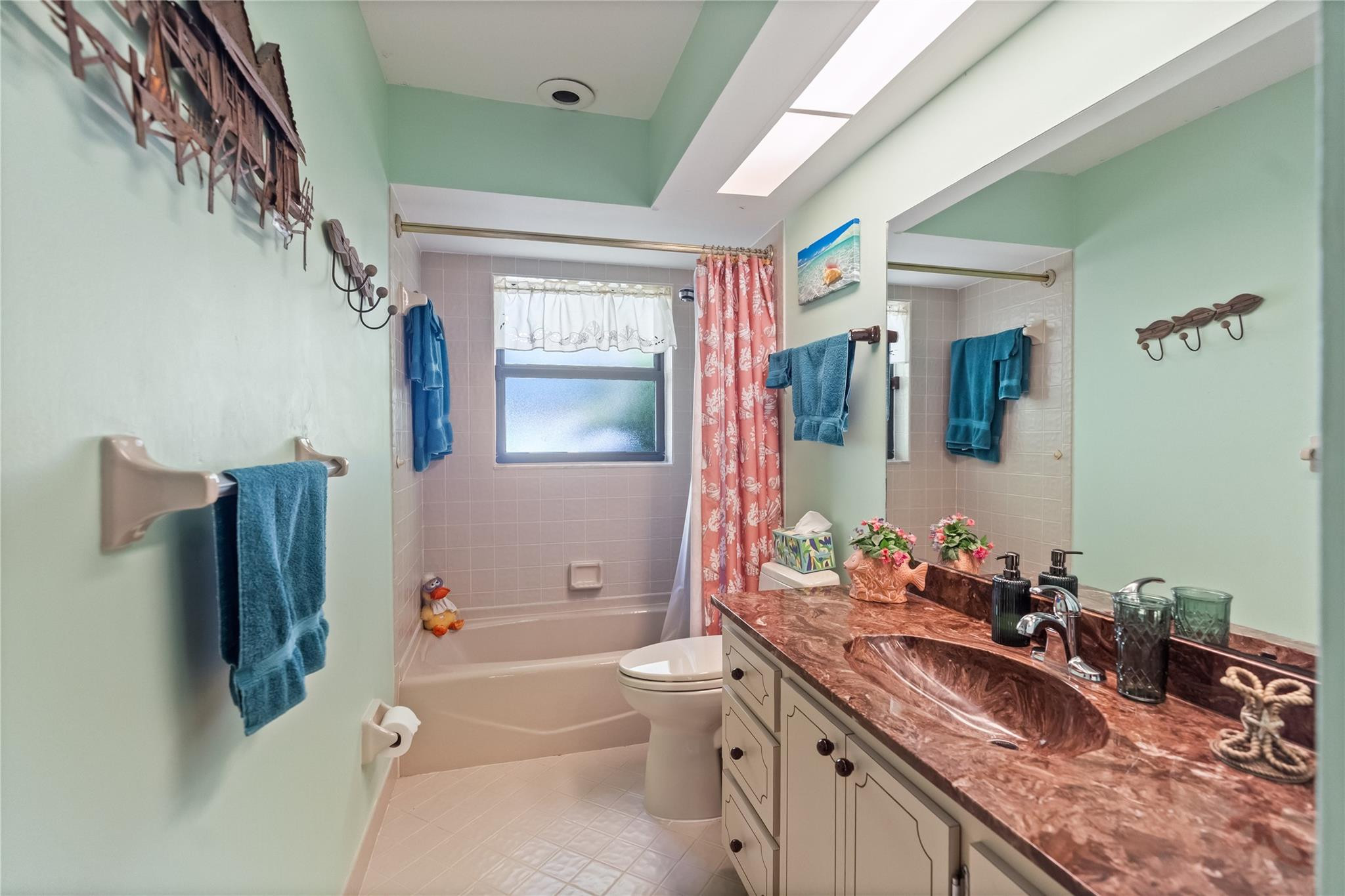 11326 Sundance Lane Boca Raton, FL 33428 - Photo 20 of 49 a bathroom with a granite countertop sink vanity mirror bathtub shower and a toilet