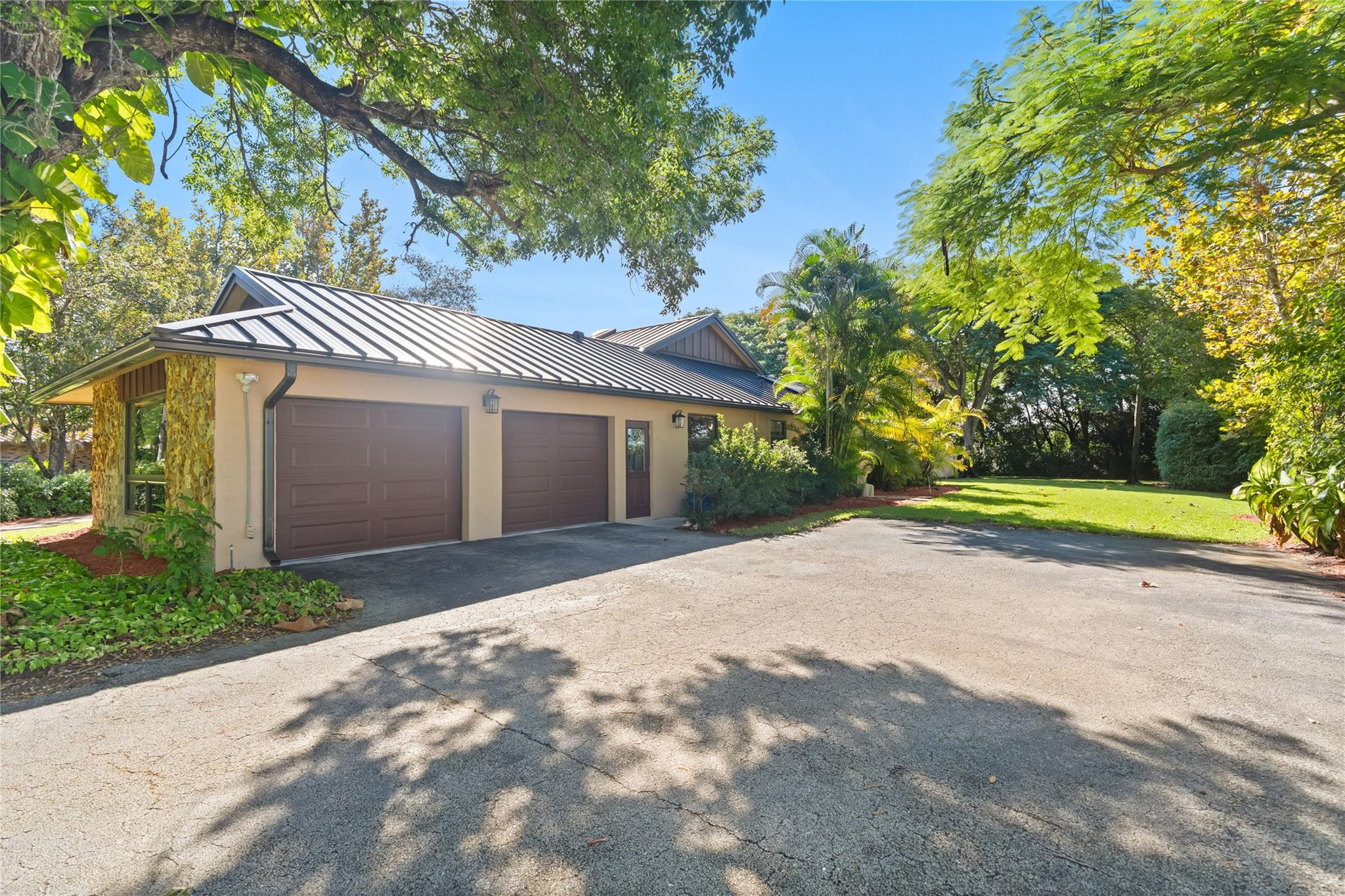 11326 Sundance Lane Boca Raton, FL 33428 - Photo 3 of 49 a front view of a house with a yard and garage