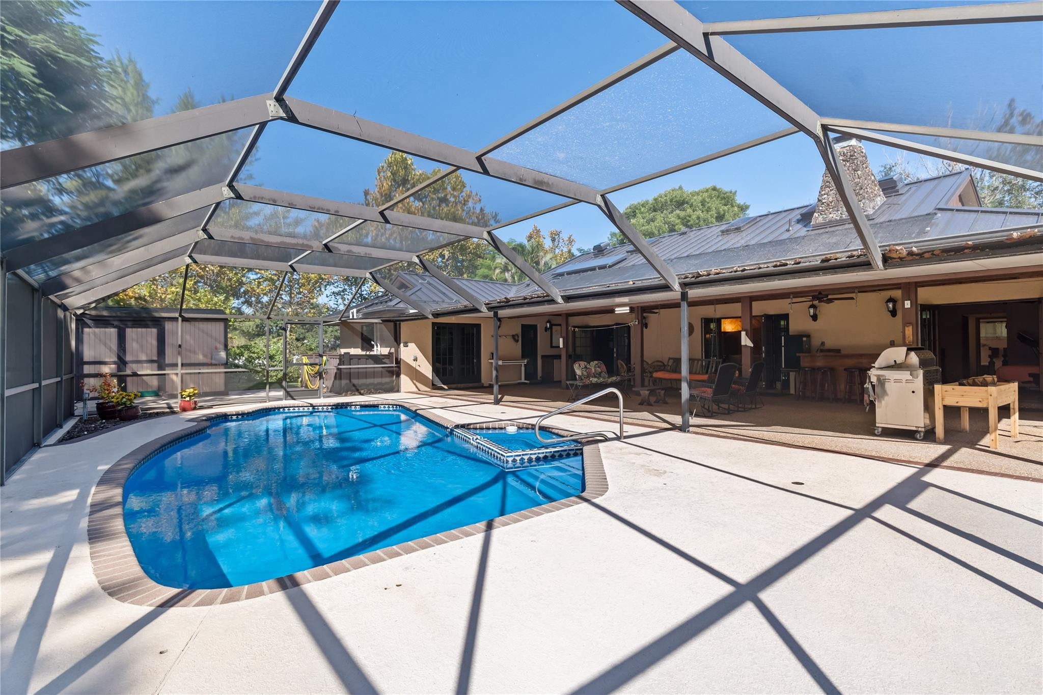 11326 Sundance Lane Boca Raton, FL 33428 - Photo 34 of 49 a view of a swimming pool with a patio