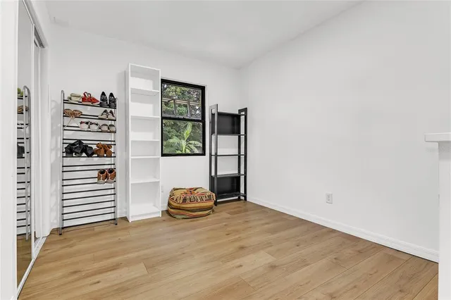 a view of a room with wooden floor and stairs