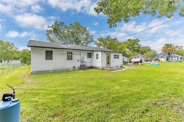 a front view of house with yard and outdoor seating