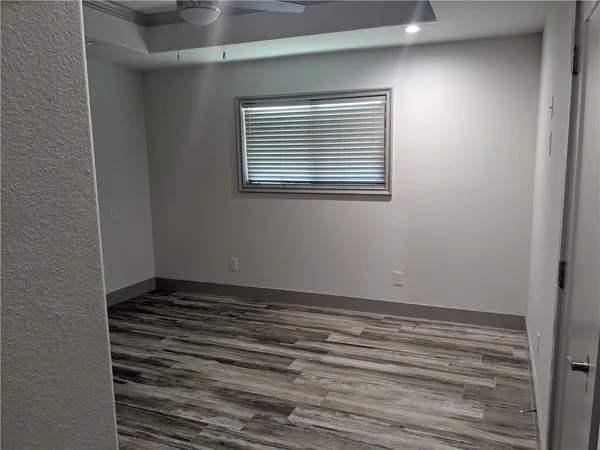 a view of an empty room with a window