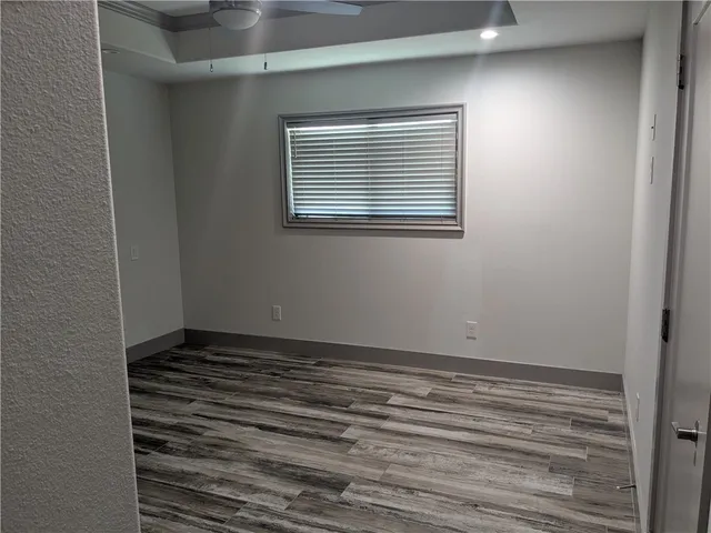 a view of an empty room with a window