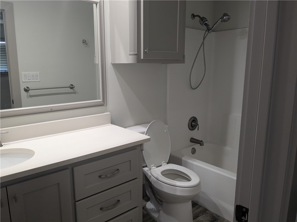 5375 County Road 73A, Unit C55 Robstown, TX 78380 - Photo 6 of 10 a bathroom with a sink a toilet and shower