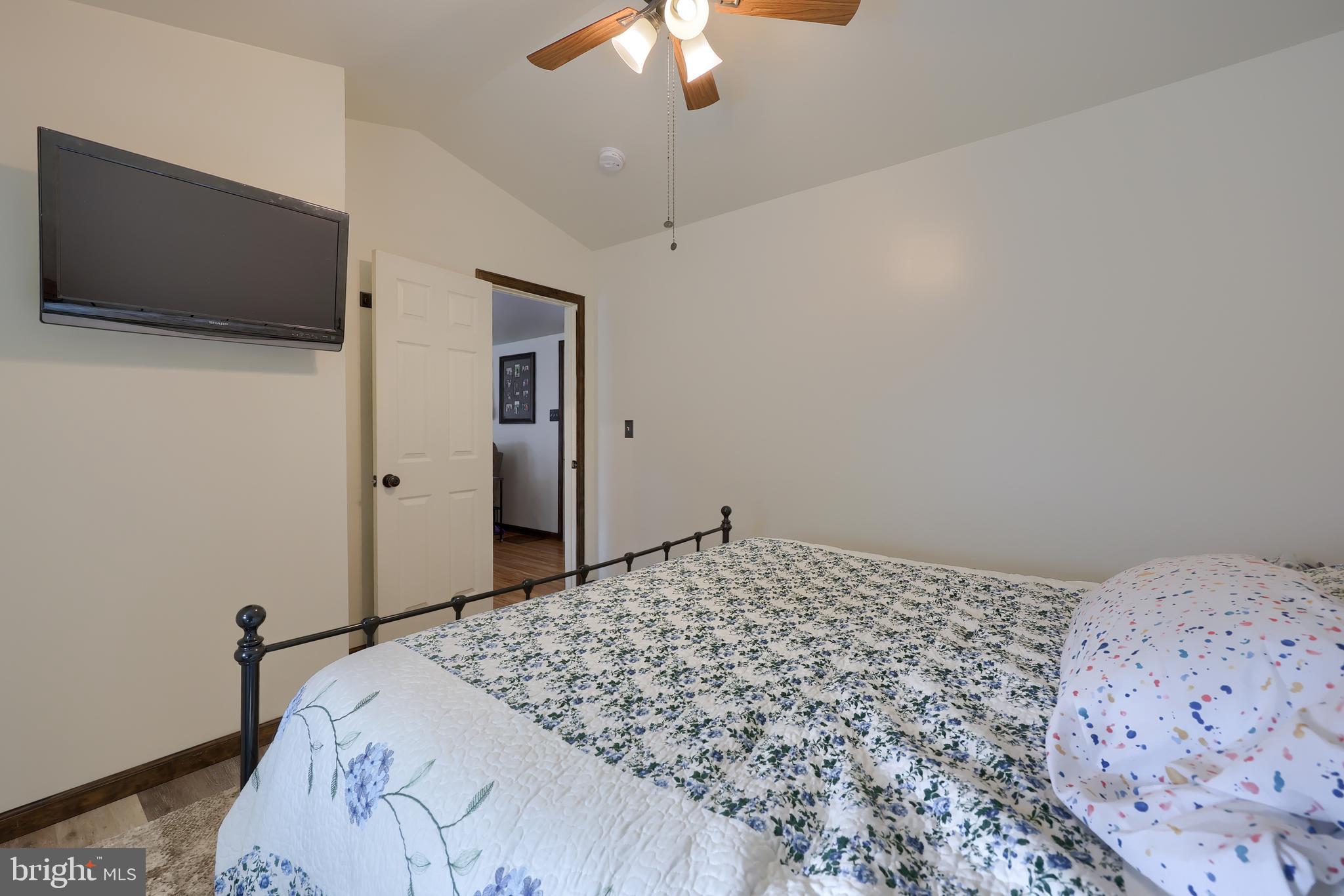 264 Noble Street Lititz, PA 17543 - Photo 16 of 28 a bedroom with a bed and a flat screen tv