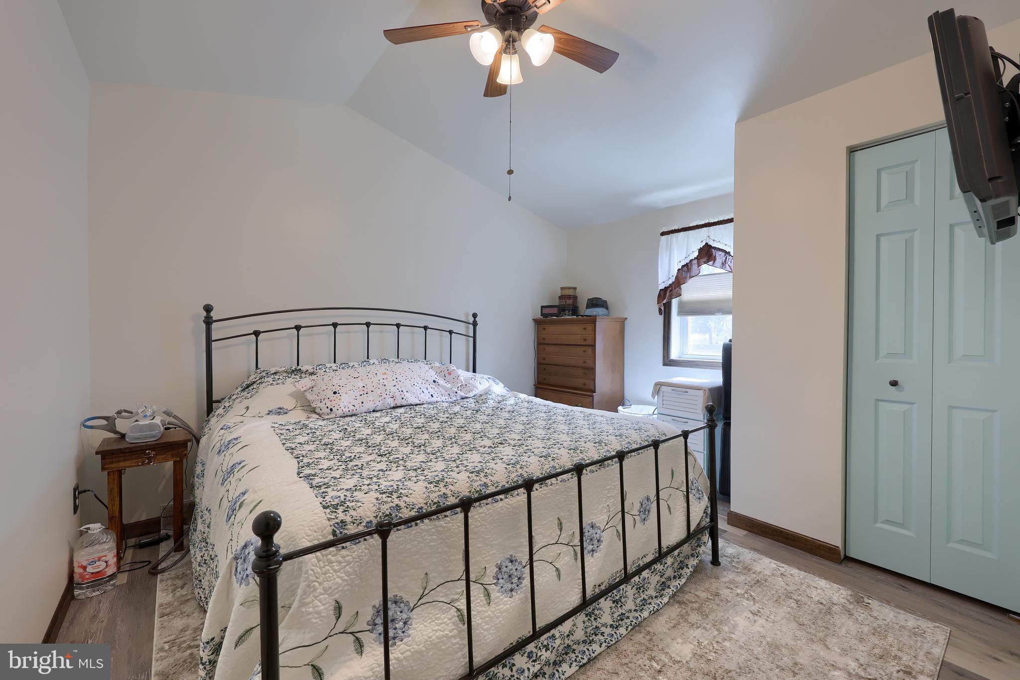 264 Noble Street Lititz, PA 17543 - Photo 17 of 28 a bedroom with a bed and a chandelier