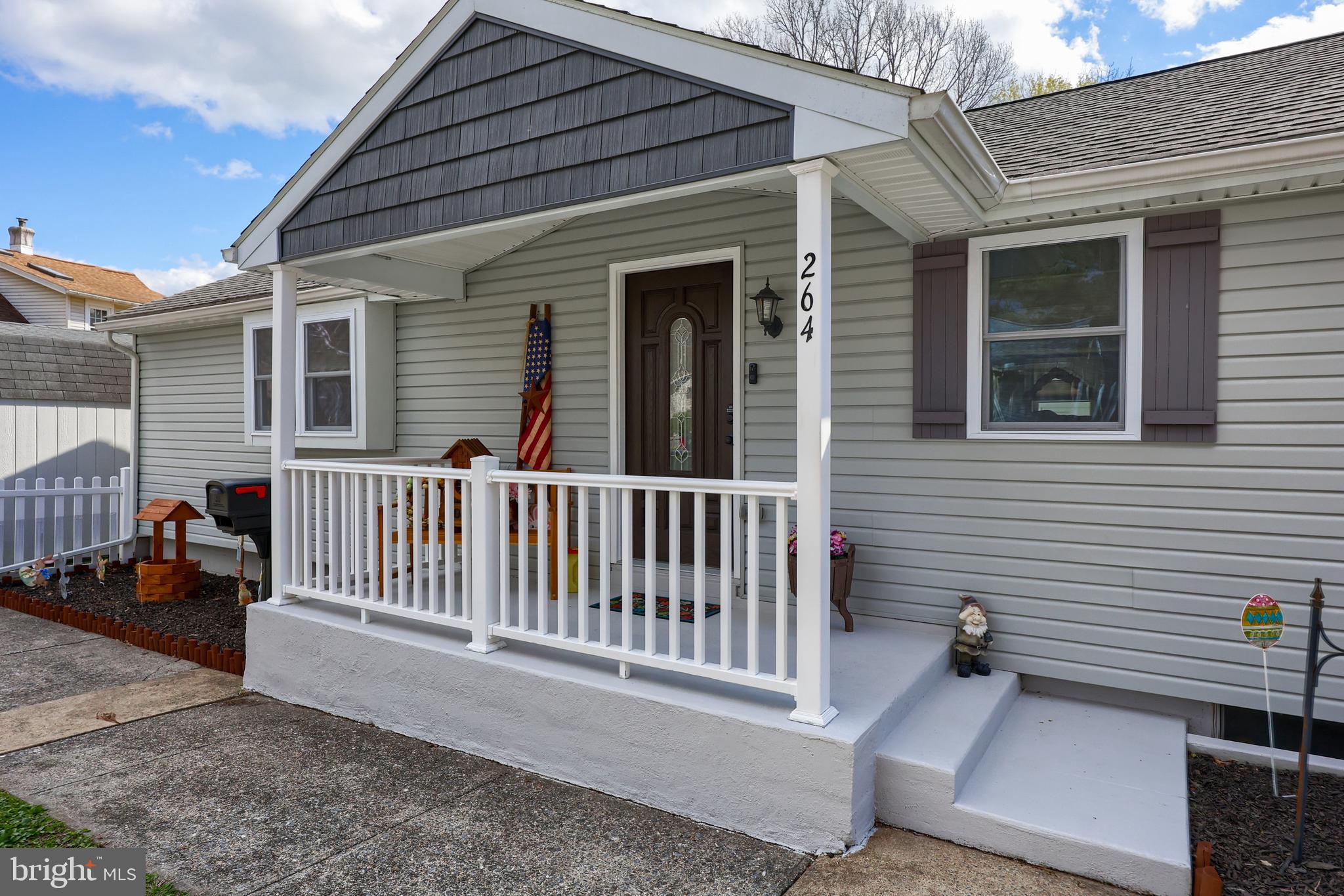 264 Noble Street Lititz, PA 17543 - Photo 2 of 28 a view of a house with a small yard and wooden fence