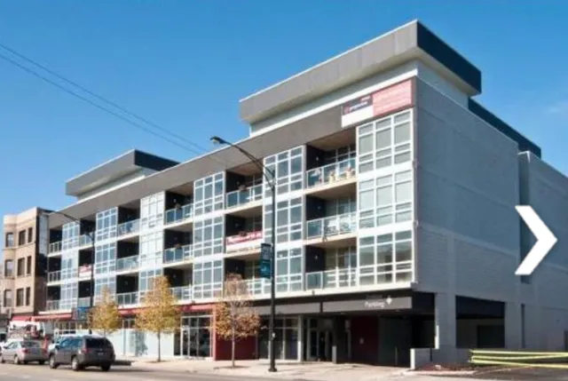a front view of a building with a street