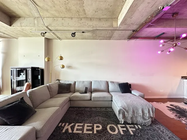 a living room with furniture and a rug