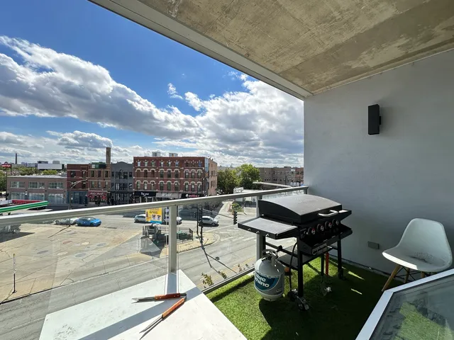 a terrace with outdoor seating and city view