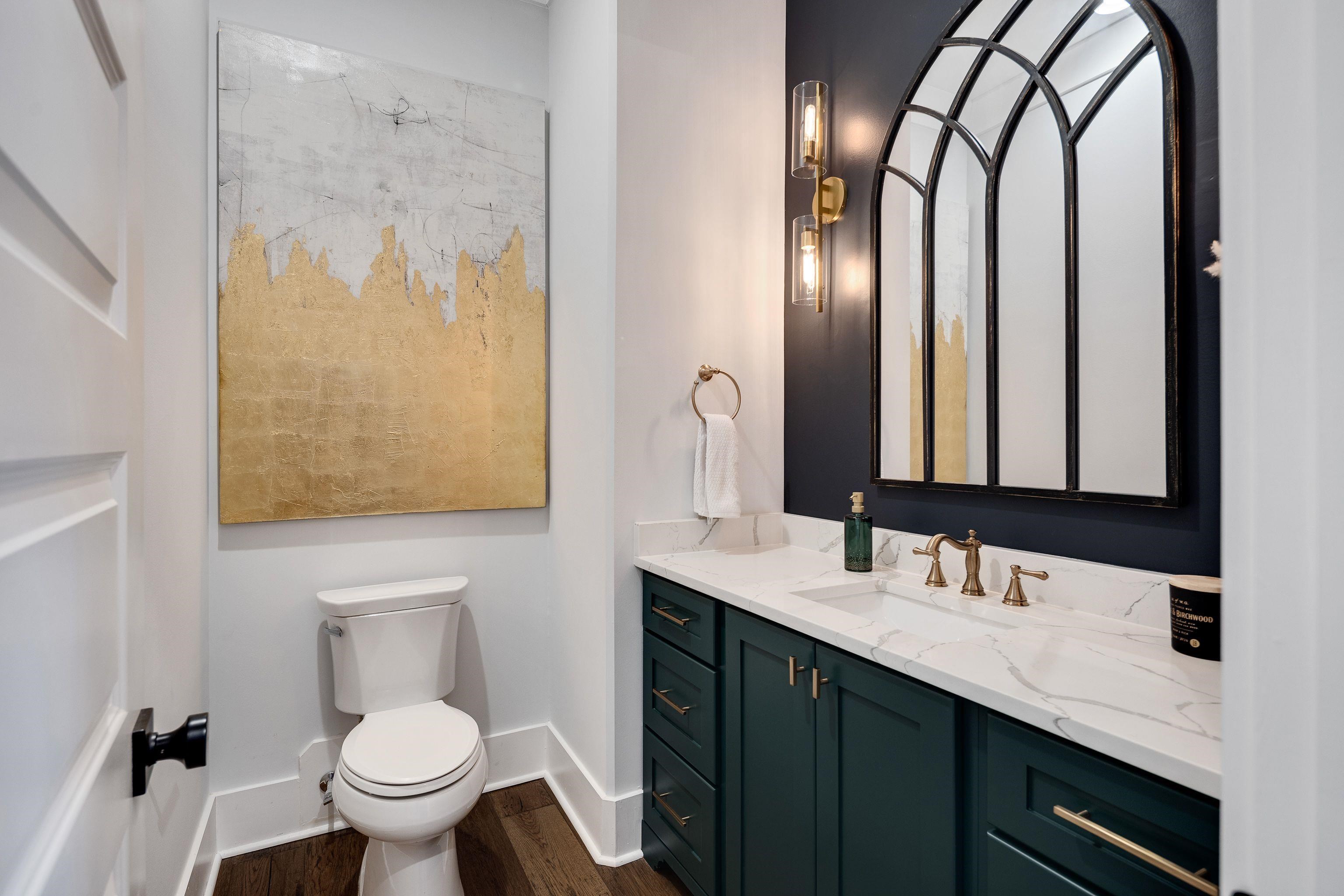 1133 Hayne Road Memphis, TN 38119 - Photo 13 of 34 Bathroom featuring vanity, baseboards, wood finished floors, and toilet