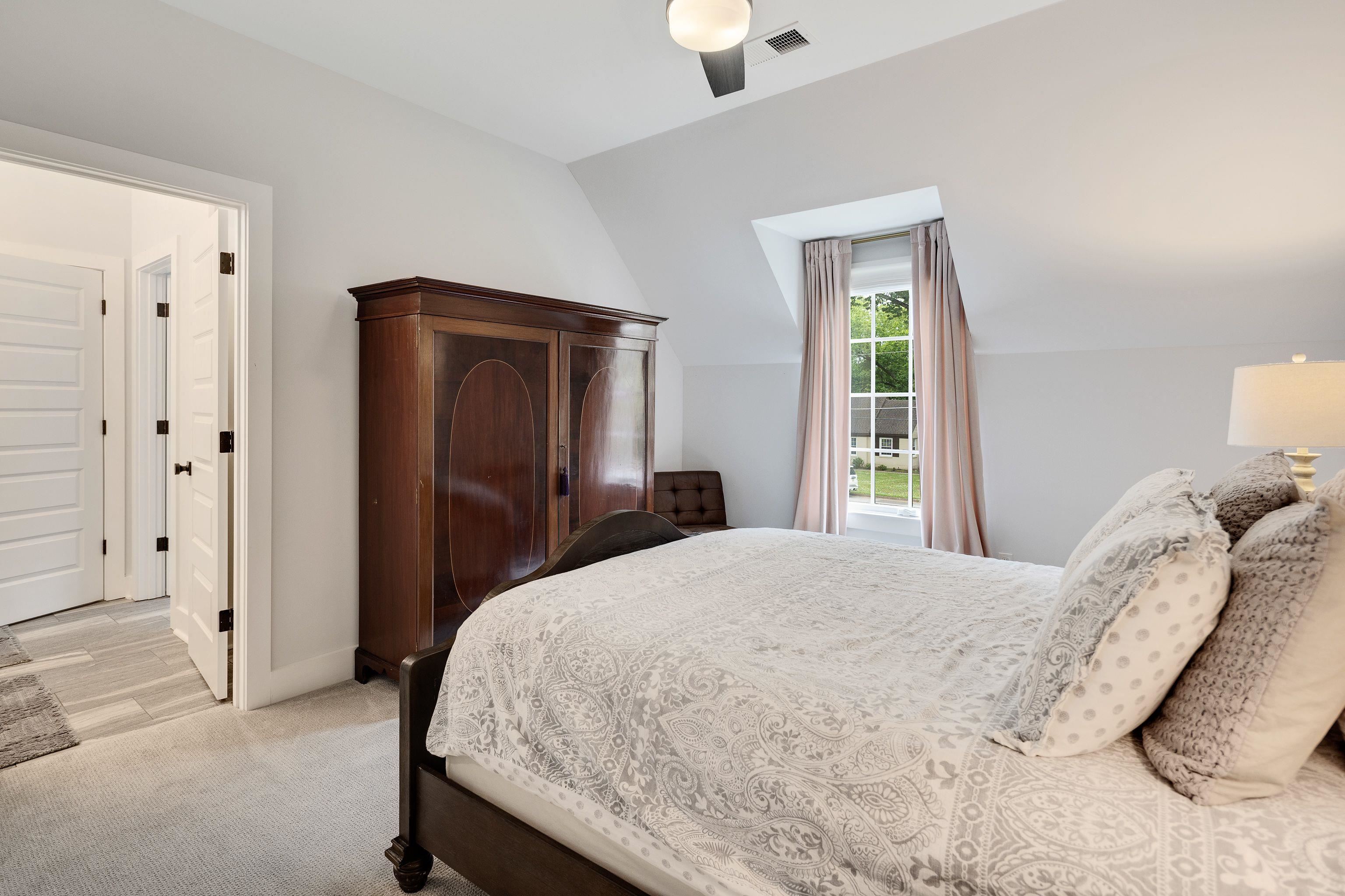 1133 Hayne Road Memphis, TN 38119 - Photo 27 of 34 Bedroom with light colored carpet, lofted ceiling, baseboards, and a ceiling fan