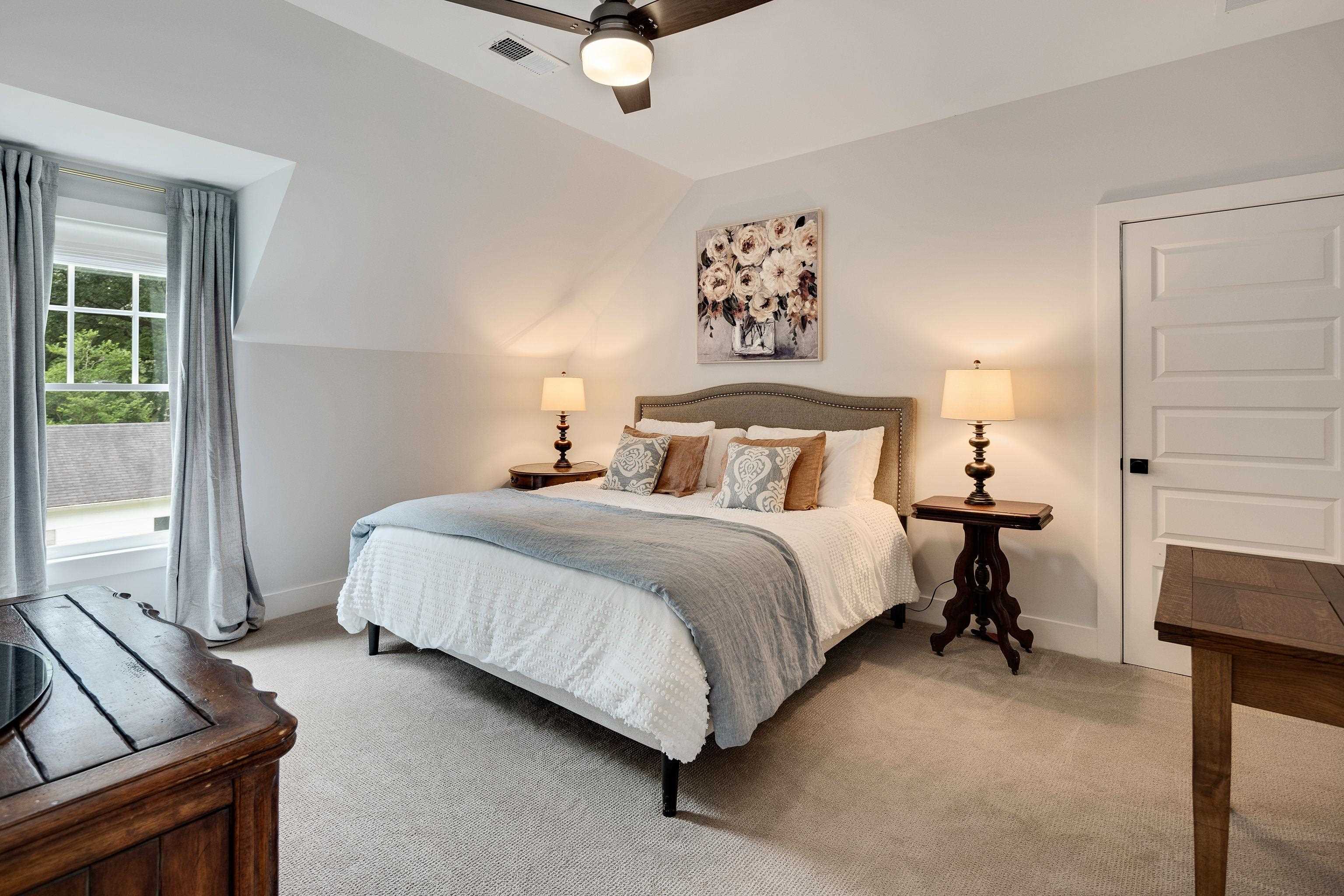 1133 Hayne Road Memphis, TN 38119 - Photo 29 of 34 Bedroom featuring light colored carpet, baseboards, lofted ceiling, and ceiling fan