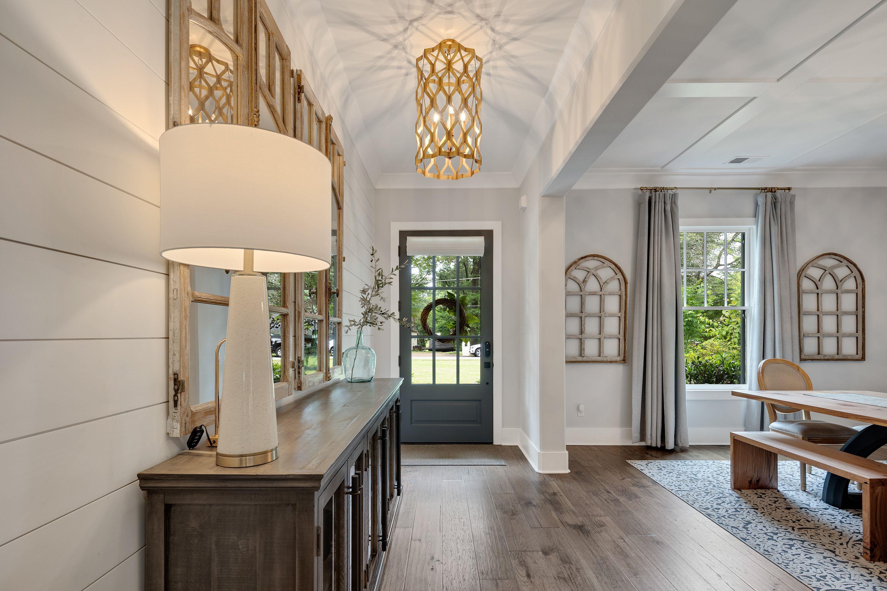 1133 Hayne Road Memphis, TN 38119 - Photo 3 of 34 Entryway featuring dark wood-style flooring, a chandelier, baseboards, and crown molding