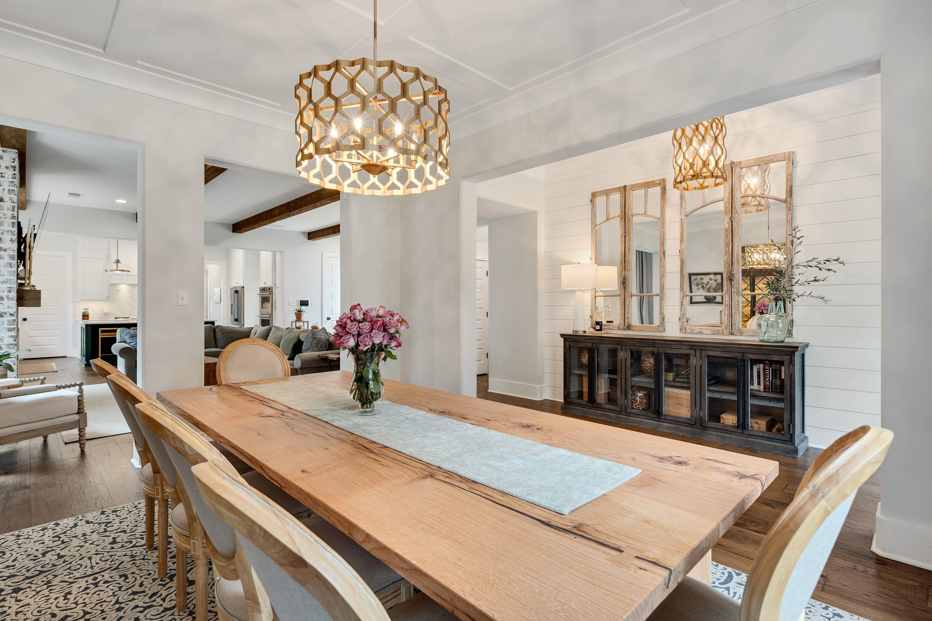 1133 Hayne Road Memphis, TN 38119 - Photo 5 of 34 Dining area with a chandelier, wood finished floors, and beam ceiling