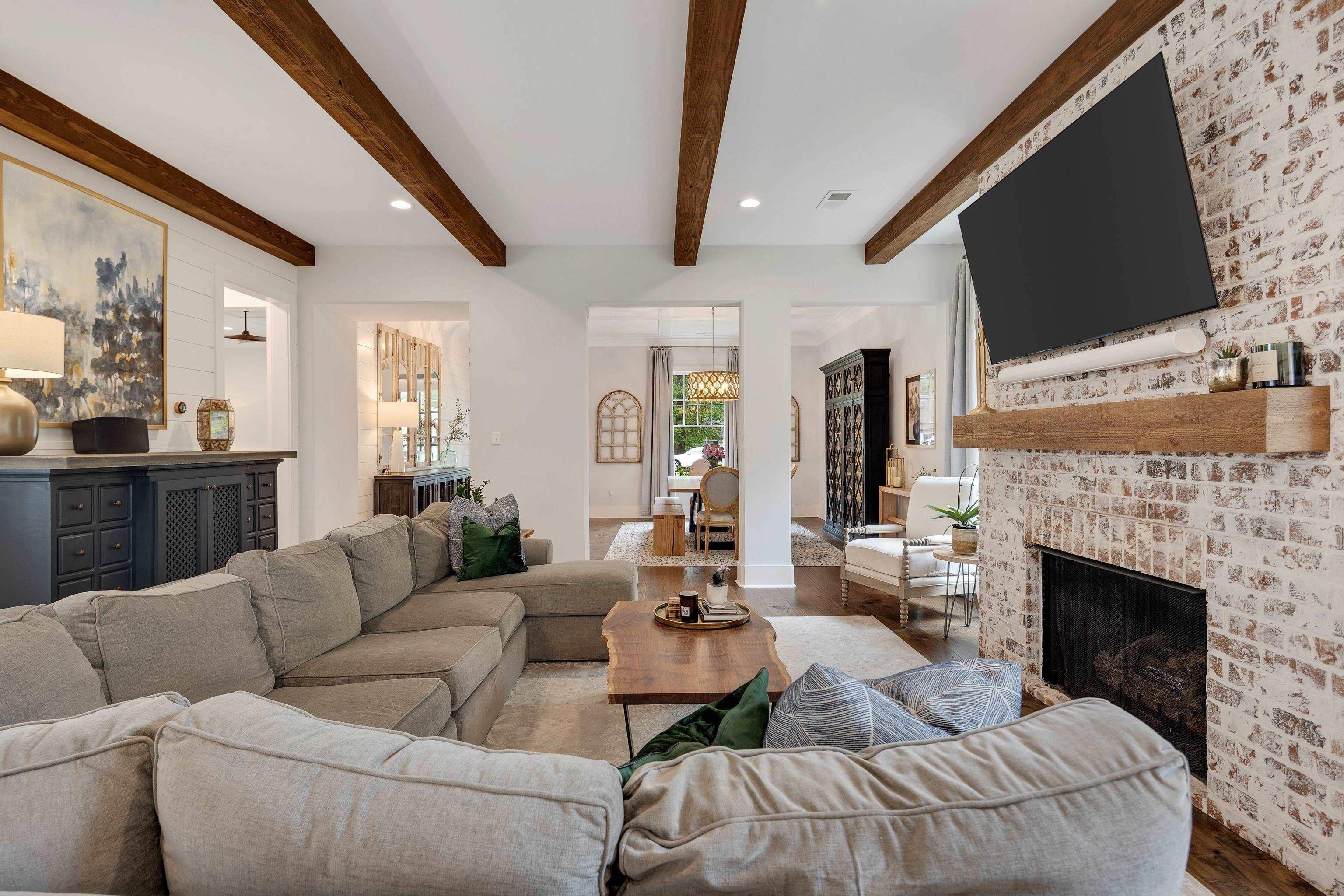 1133 Hayne Road Memphis, TN 38119 - Photo 6 of 34 Living room with wood finished floors, beamed ceiling, a fireplace, recessed lighting, and baseboards